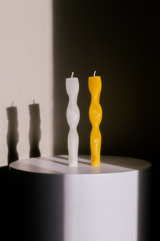 Two Handmade Wavy Sculptural Candles Made from Yellow and White Beeswax