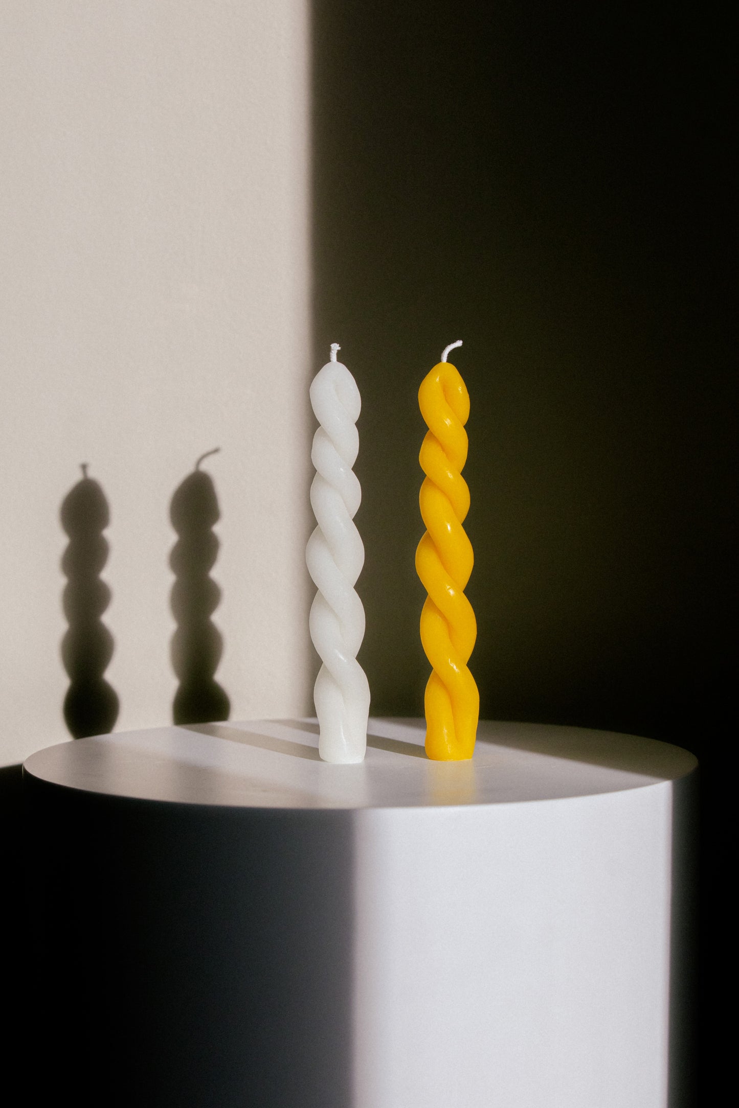Two Slim Handmade Twisted Sculptural Candles Made from Yellow and White Beeswax